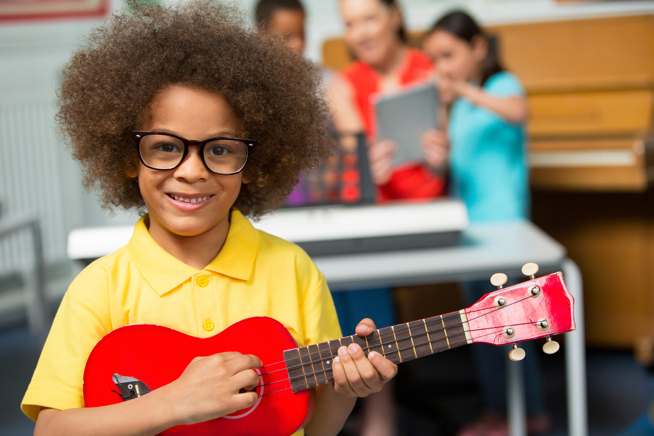 Young Boy Playing Ukulele