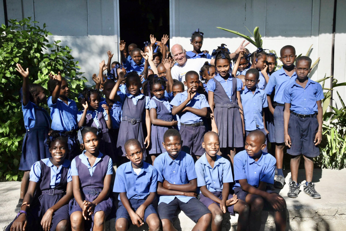 Jonathan Nash Glynn with Wings Over Haiti students