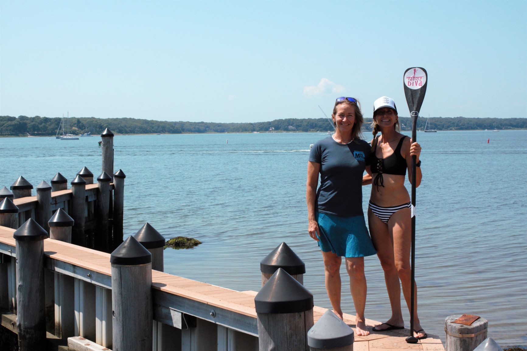 Evelyn O'Doherty and Gina Bradley help Stand Up for the Ocean paddle race