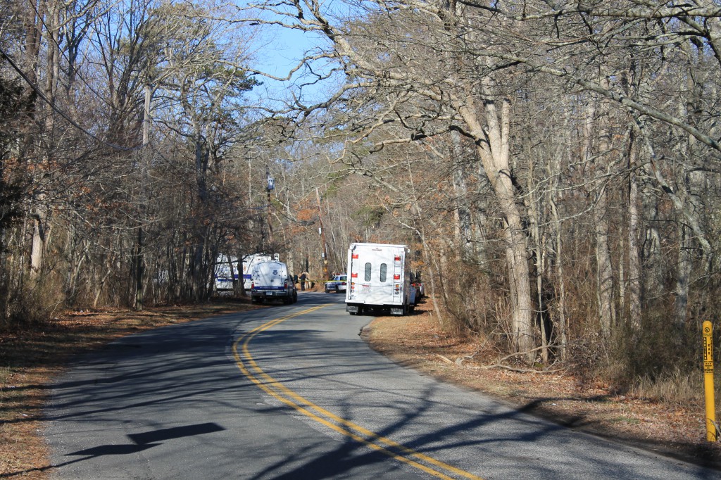 Suffolk County police keep watch over the area in Manorville where skeletal remains were found on Friday, Feb. 17 2012