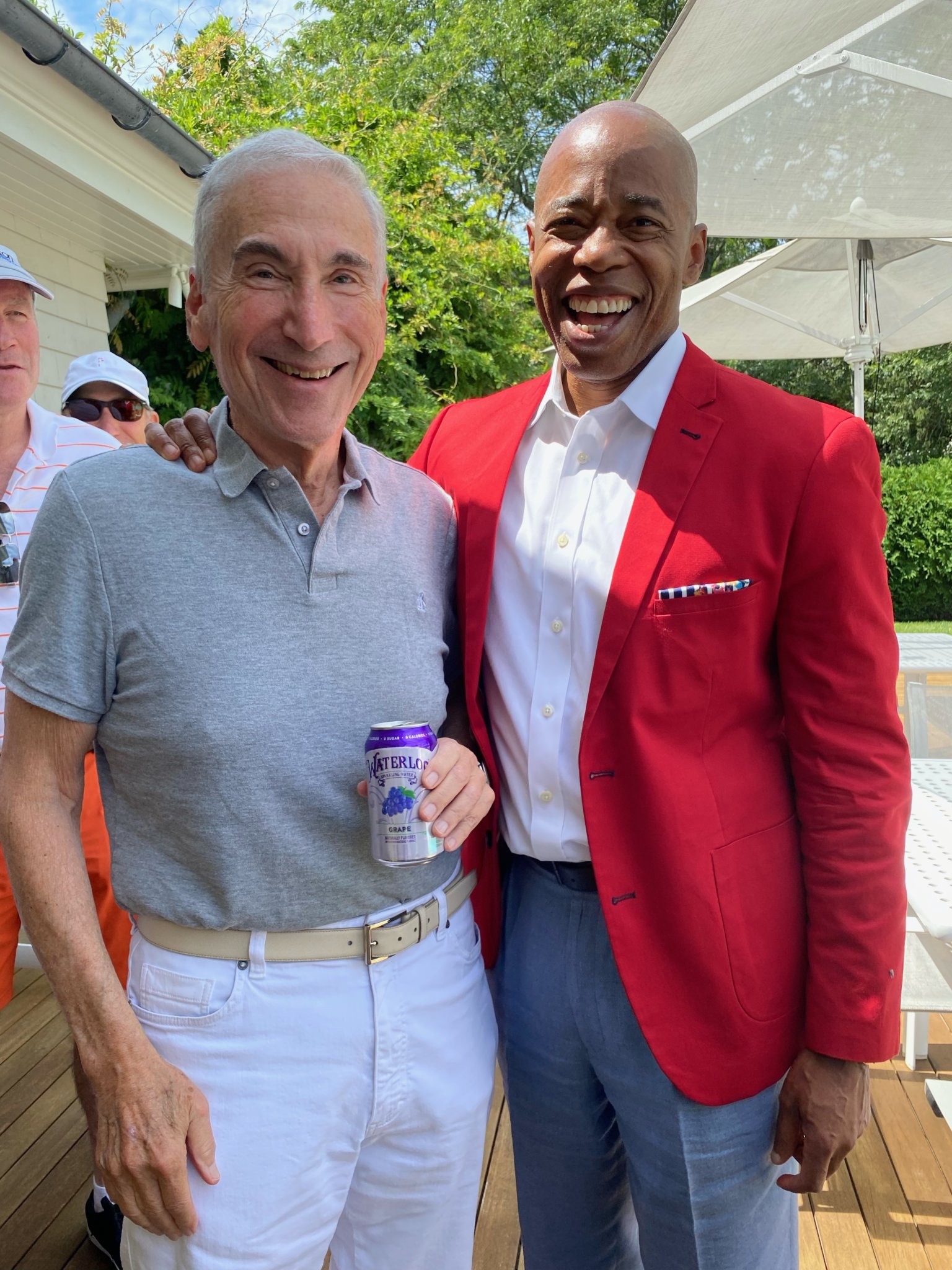 Jerry Levin presents his company’s drink, Waterloo Sparkling Water, to Eric Adams