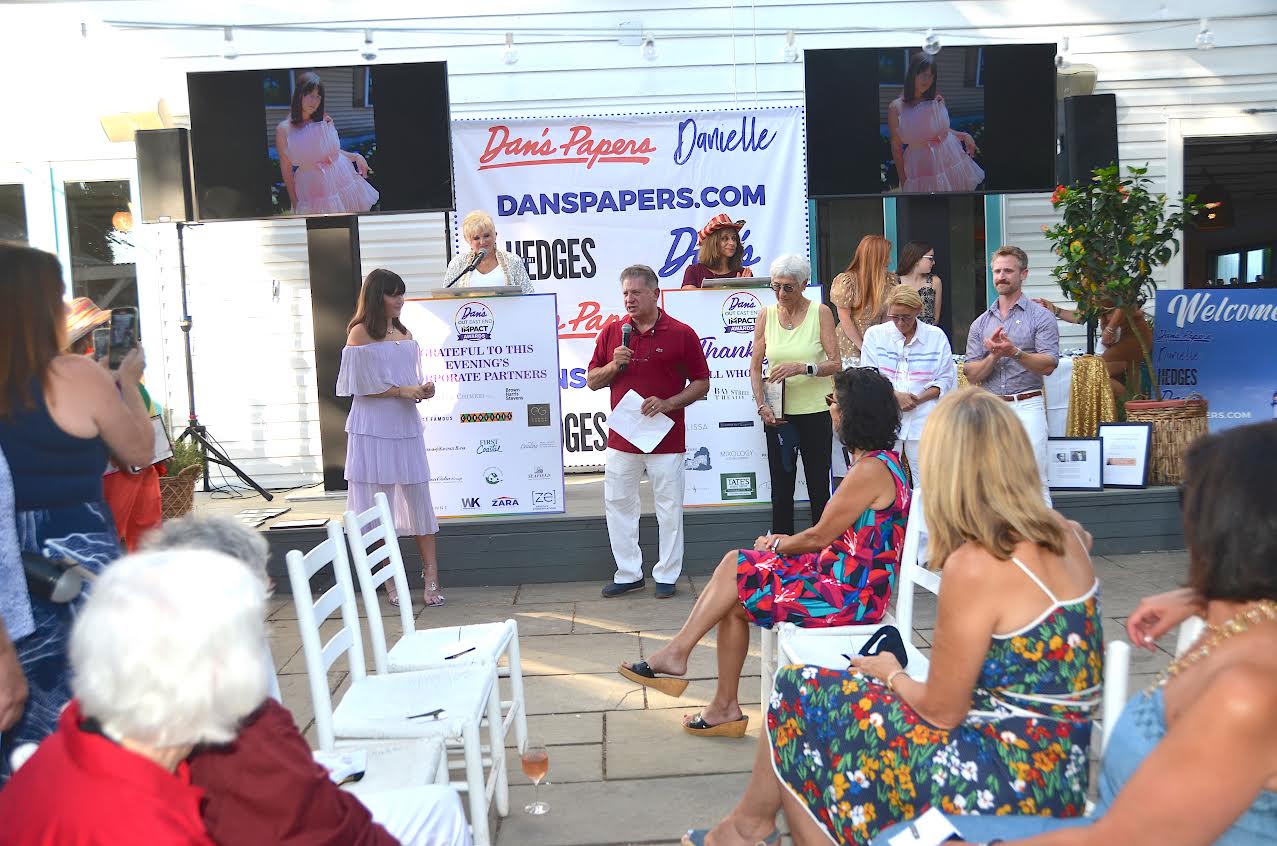 Mitch Draizin presenting Jackie Iulo with the Youth Leadership Award at the Dan's Papers Out East End Impact Awards