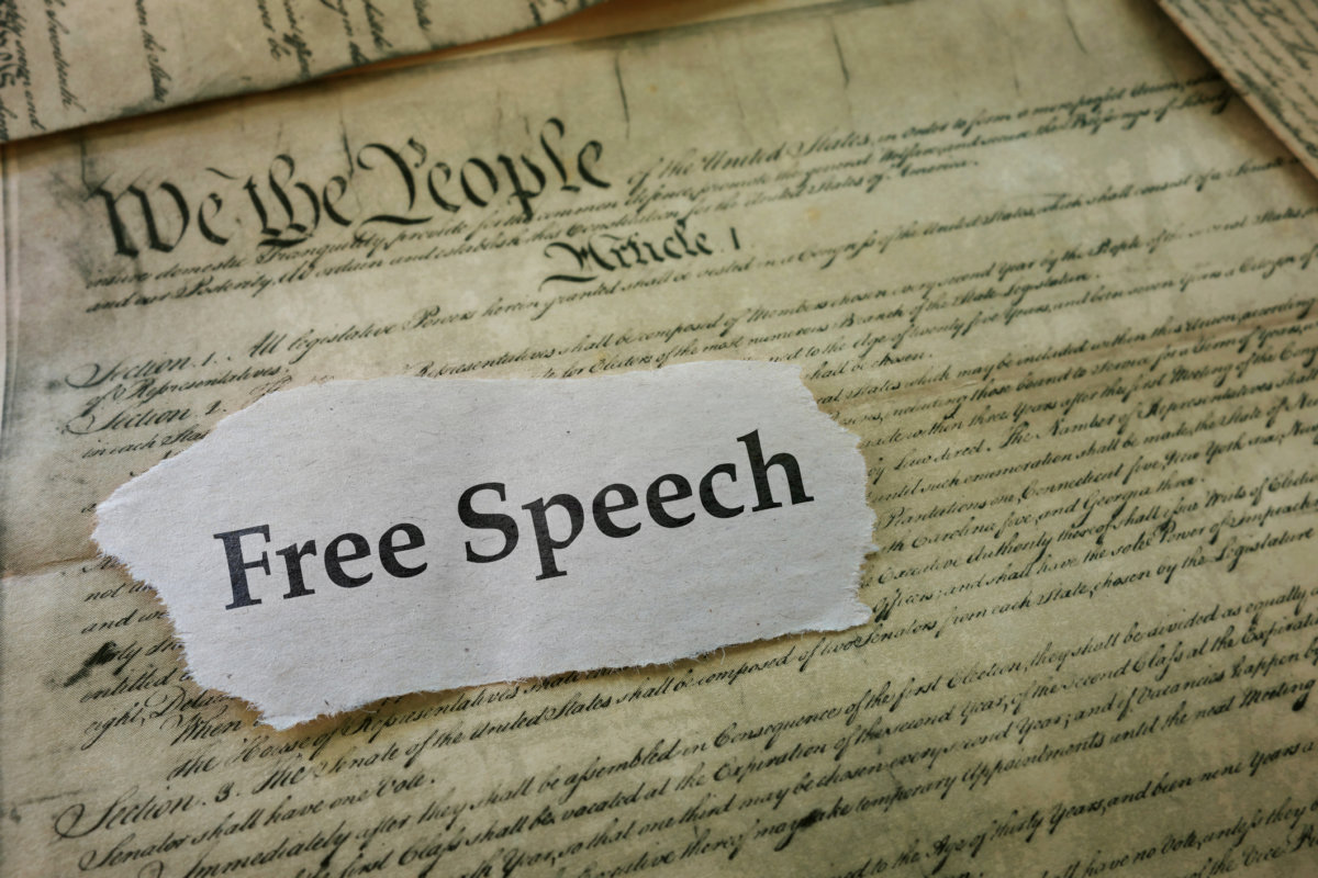 Learn your rights - Free Speech newspaper headline on a copy of the United States Constitution