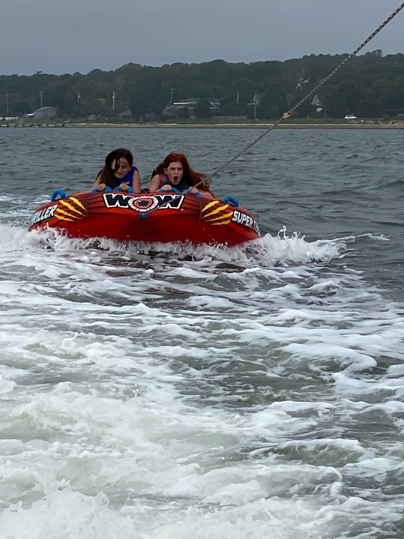 Morgan and Addy holding on for their lives tubing