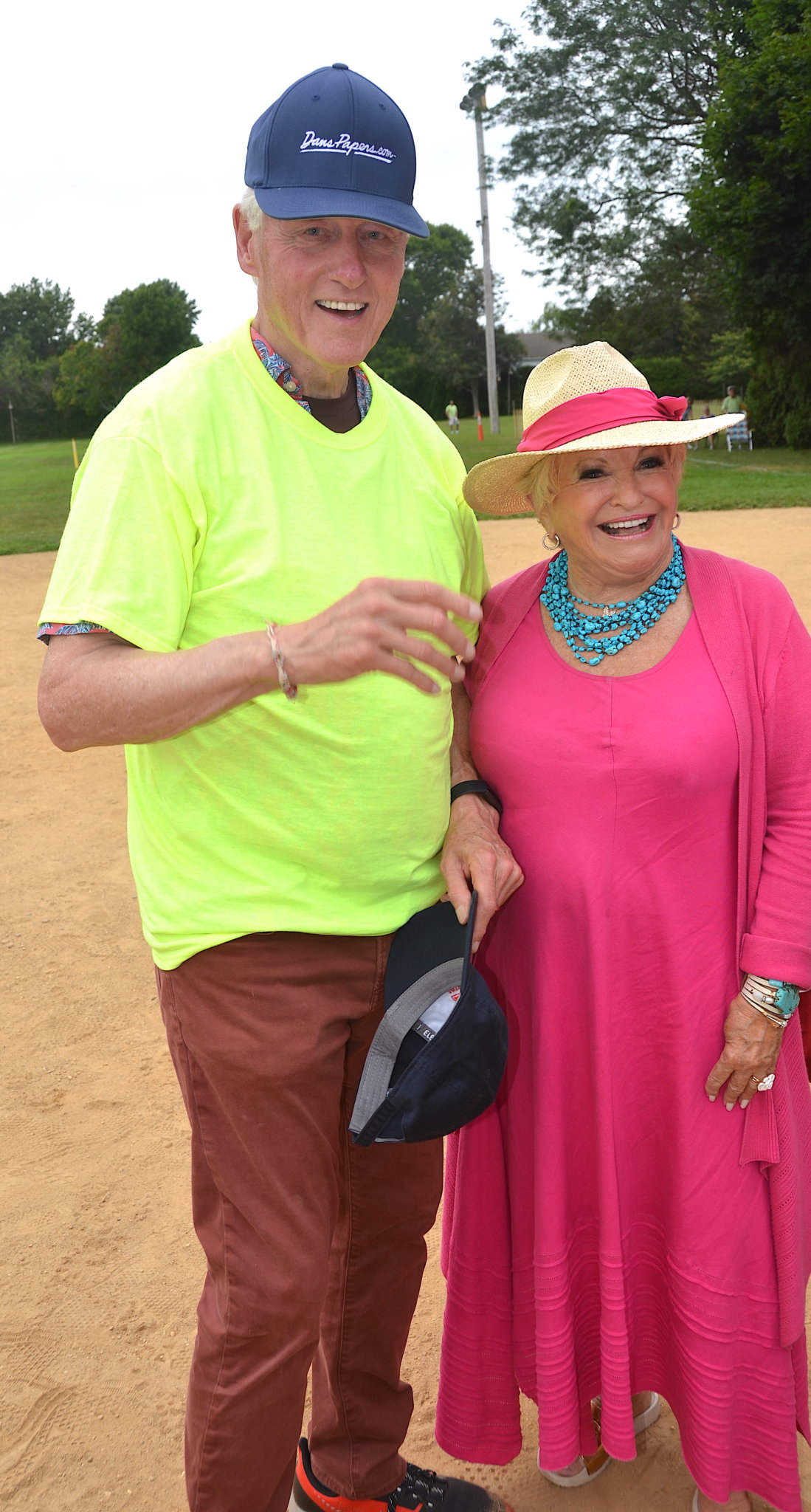 President Bill Clinton on the Artists & Writers Game 2021 field in his neon umpire shirt