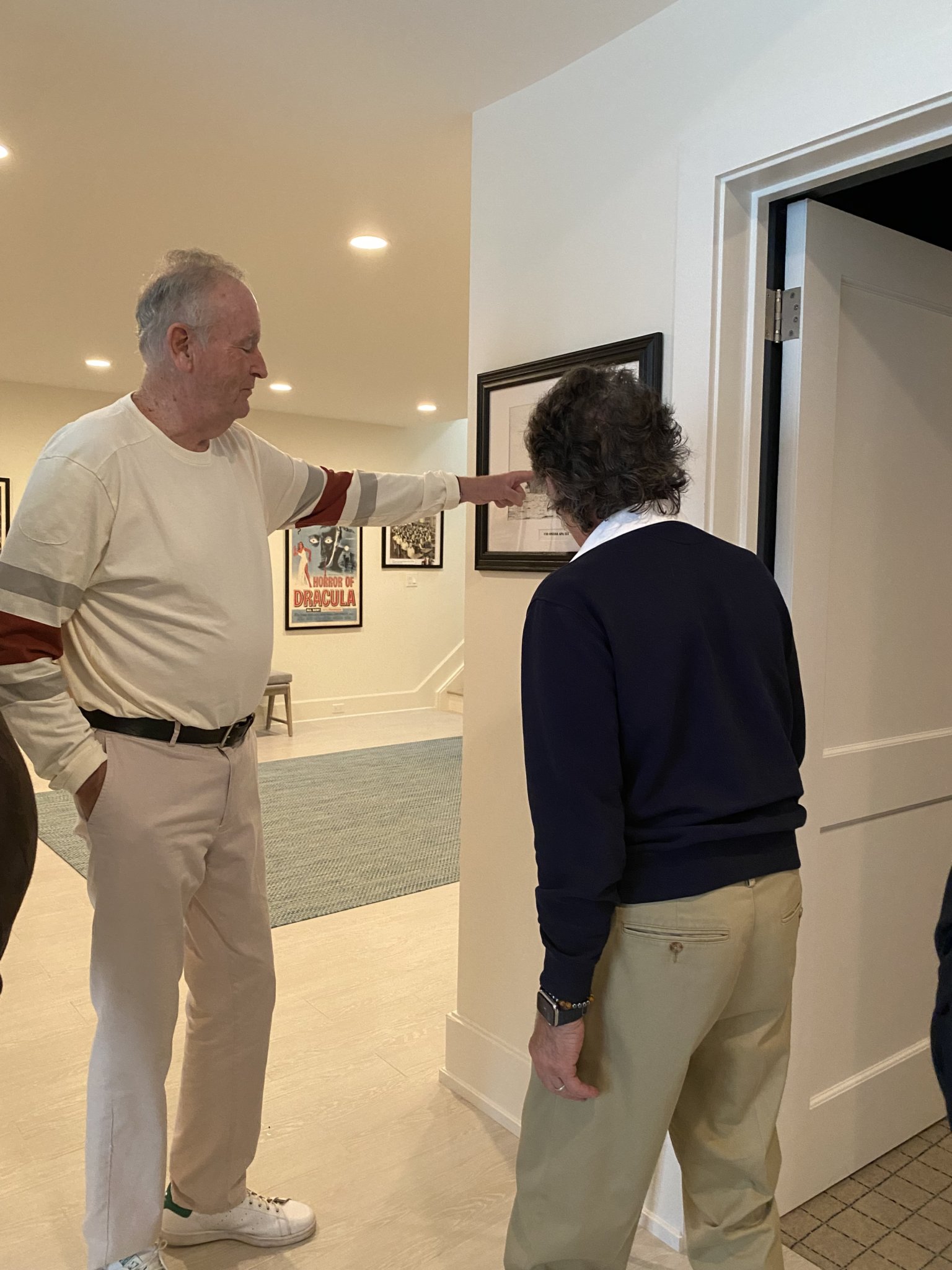 Bill O'reilly shows Geraldo Rivera the photo of the battleship where his grandfather served in World War II, on display at his Montauk home