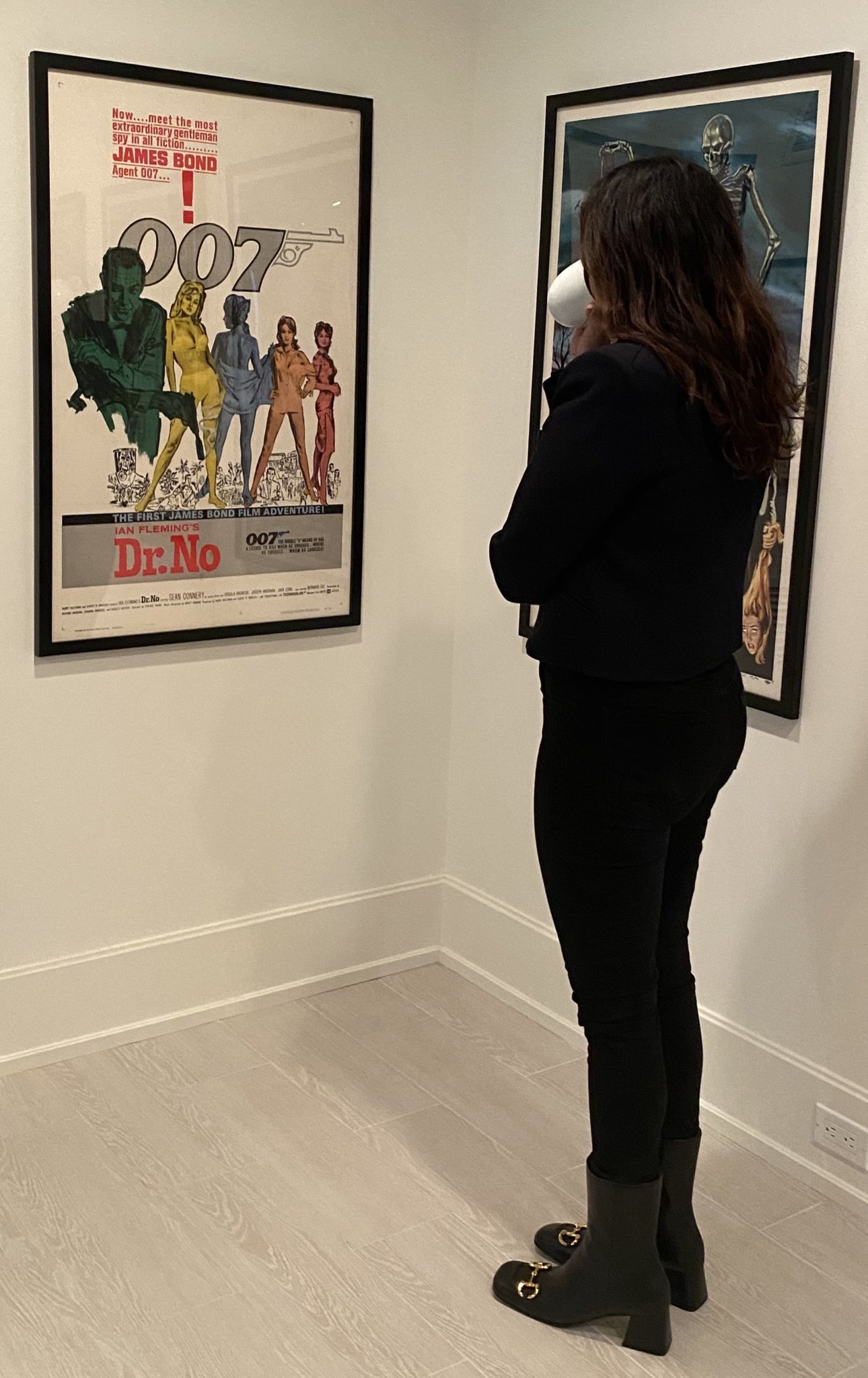 Geraldo Rivera’s wife Erica Levy checks Bill O'Reilly’s collection of original old movie posters at his home in Montauk