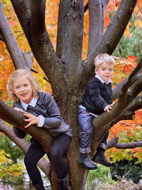Photo two children in a tree by Lucille Khornak