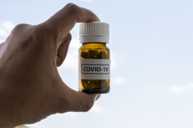 Novel coronavirus disease 2019-nCoV Hand held pills bottle for COVID treatment