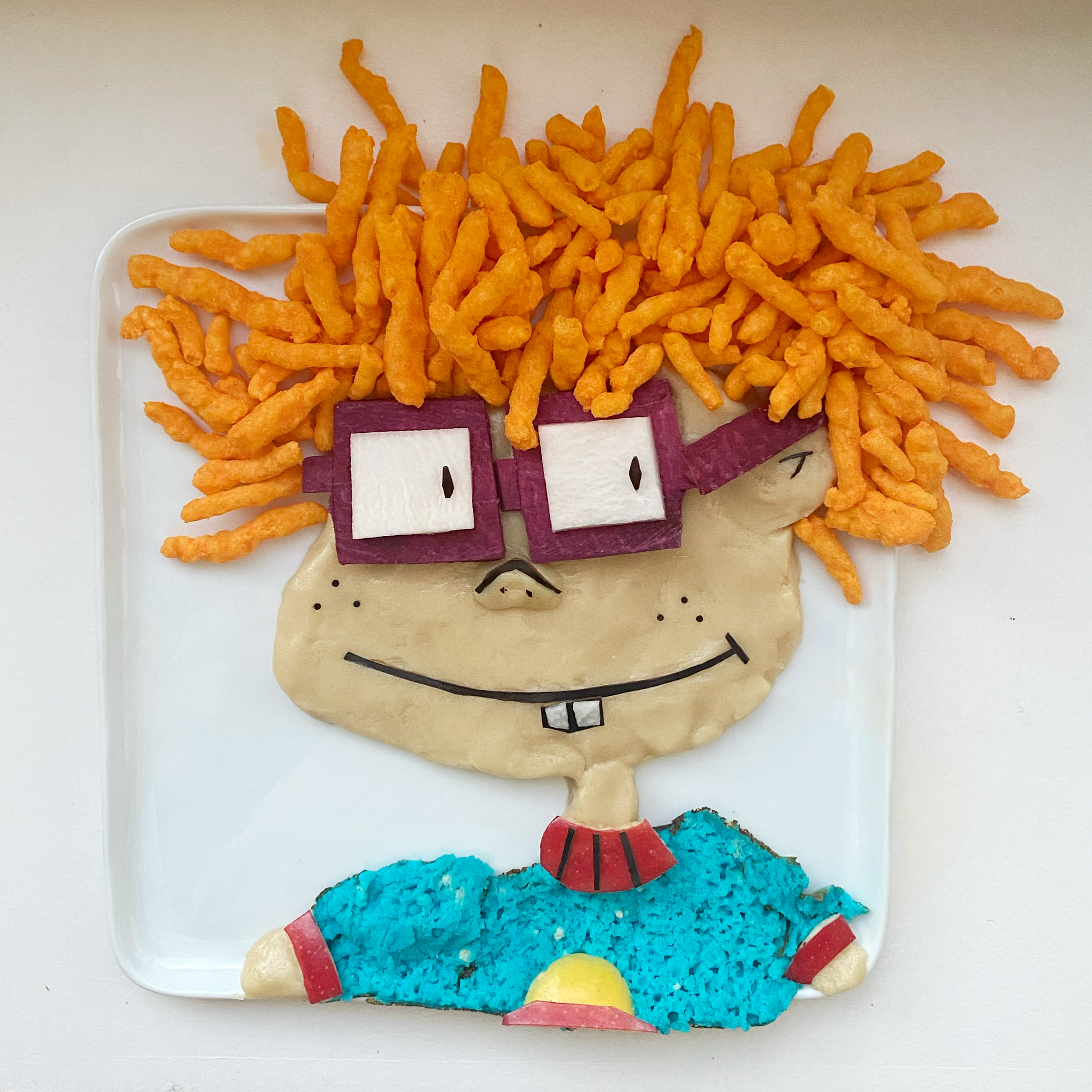 Chuckie from Rugrats – cookie dough, cheese curls, dyed pancake, apples, purple potato, eggplant and turnip by Harley Langberg