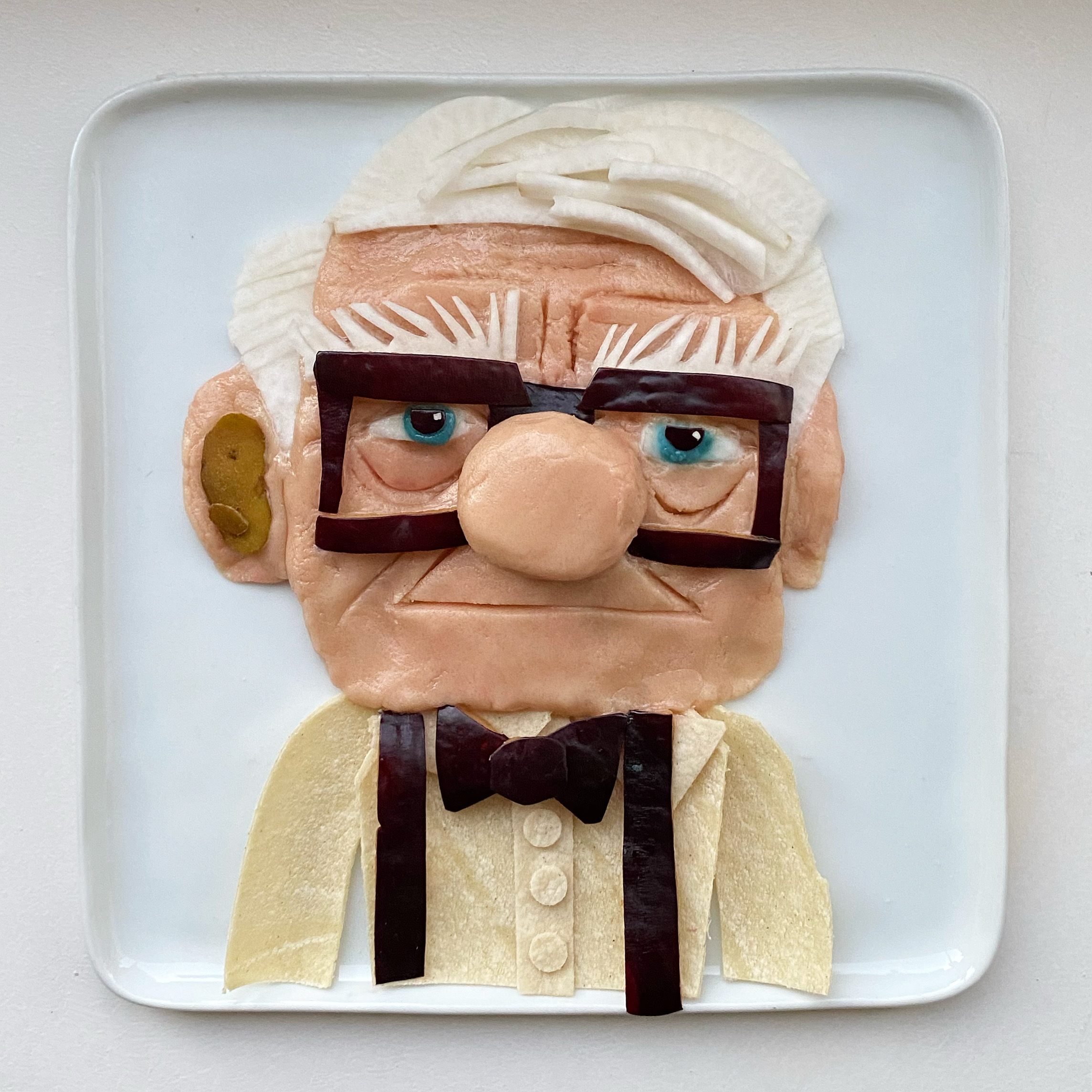 Carl Fredrickson from Pixar’s Up – colored cookie dough, tortilla, plum, pear, and turnip by Harley Langberg