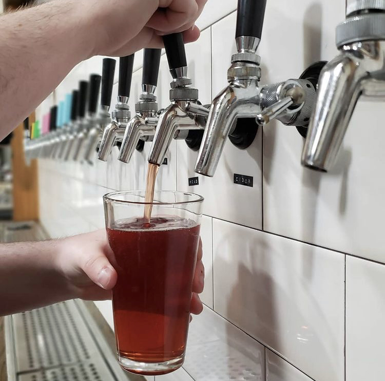 Pouring a pint at übergeek's Riverhead tasting room