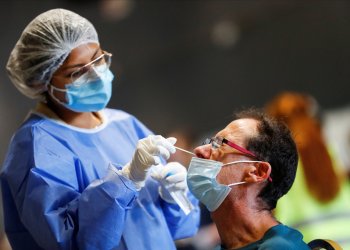 Man swabbed for COZVID-19 test