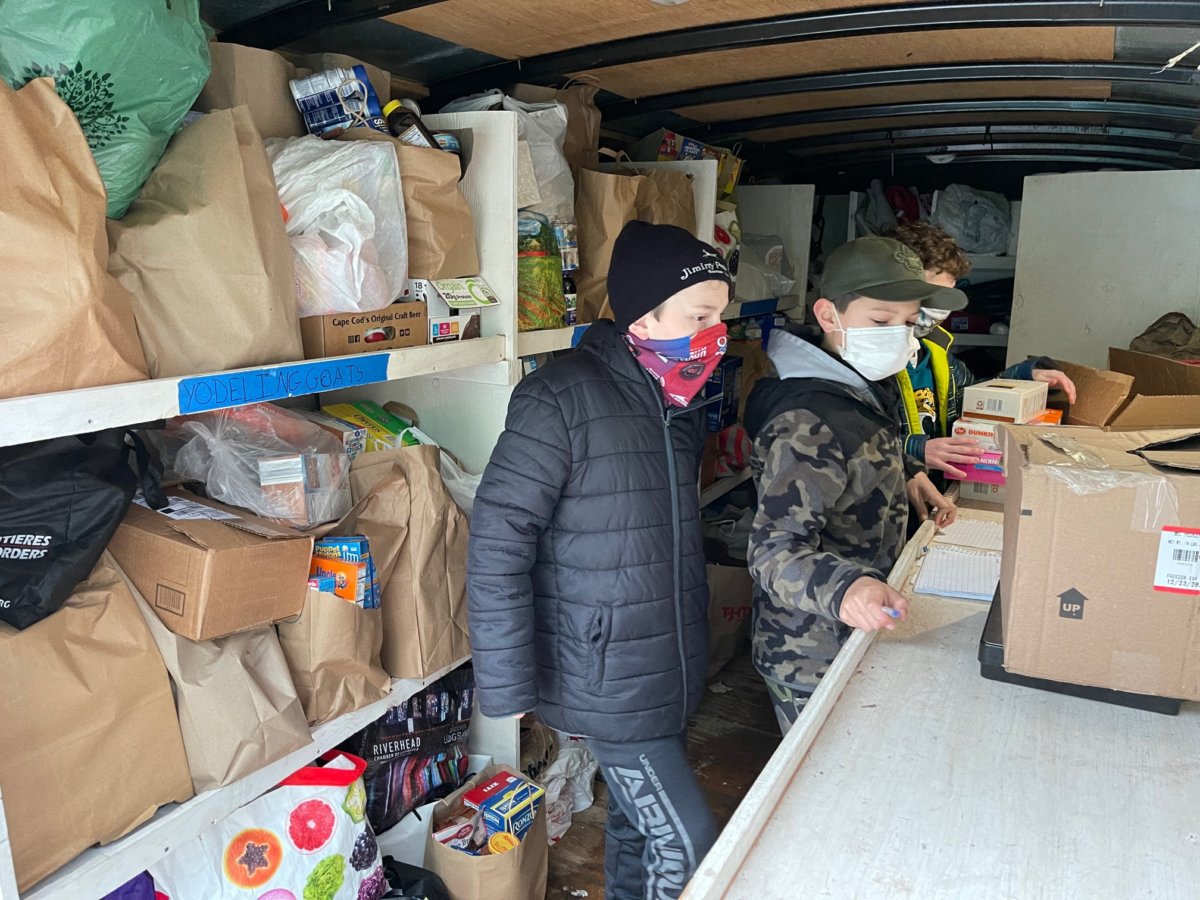 Boy Scouts from Hampton Bays Troop 483 collect canned food