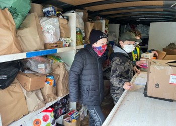 Boy Scouts from Hampton Bays Troop 483 collect canned food
