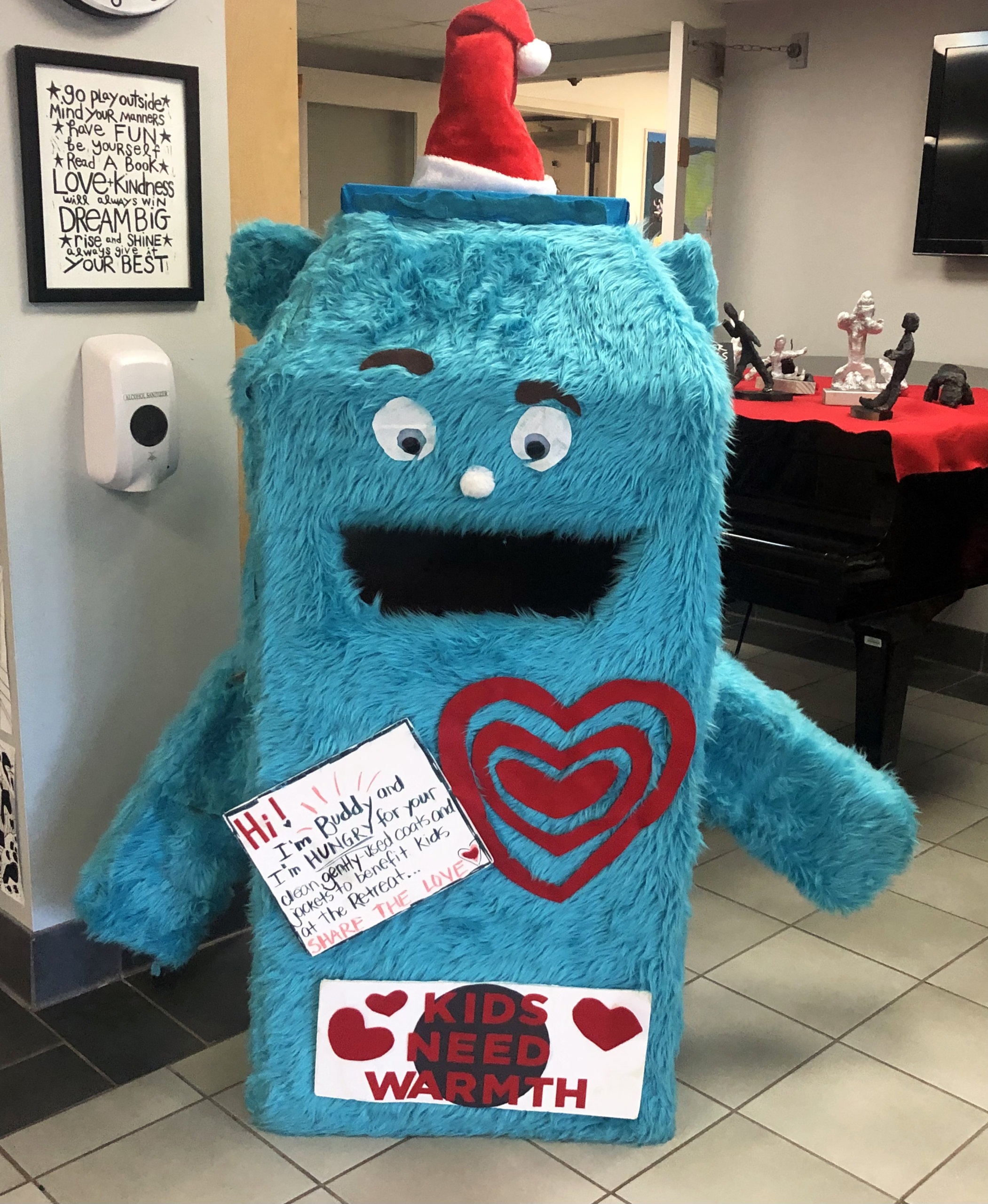 Visit Buddy the Cuddle Monster to help the Kids Need Warmth Coat Drive