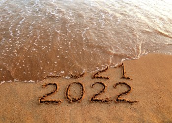 New year 2022 and old year 2021 on sandy beach with waves Hamptons
