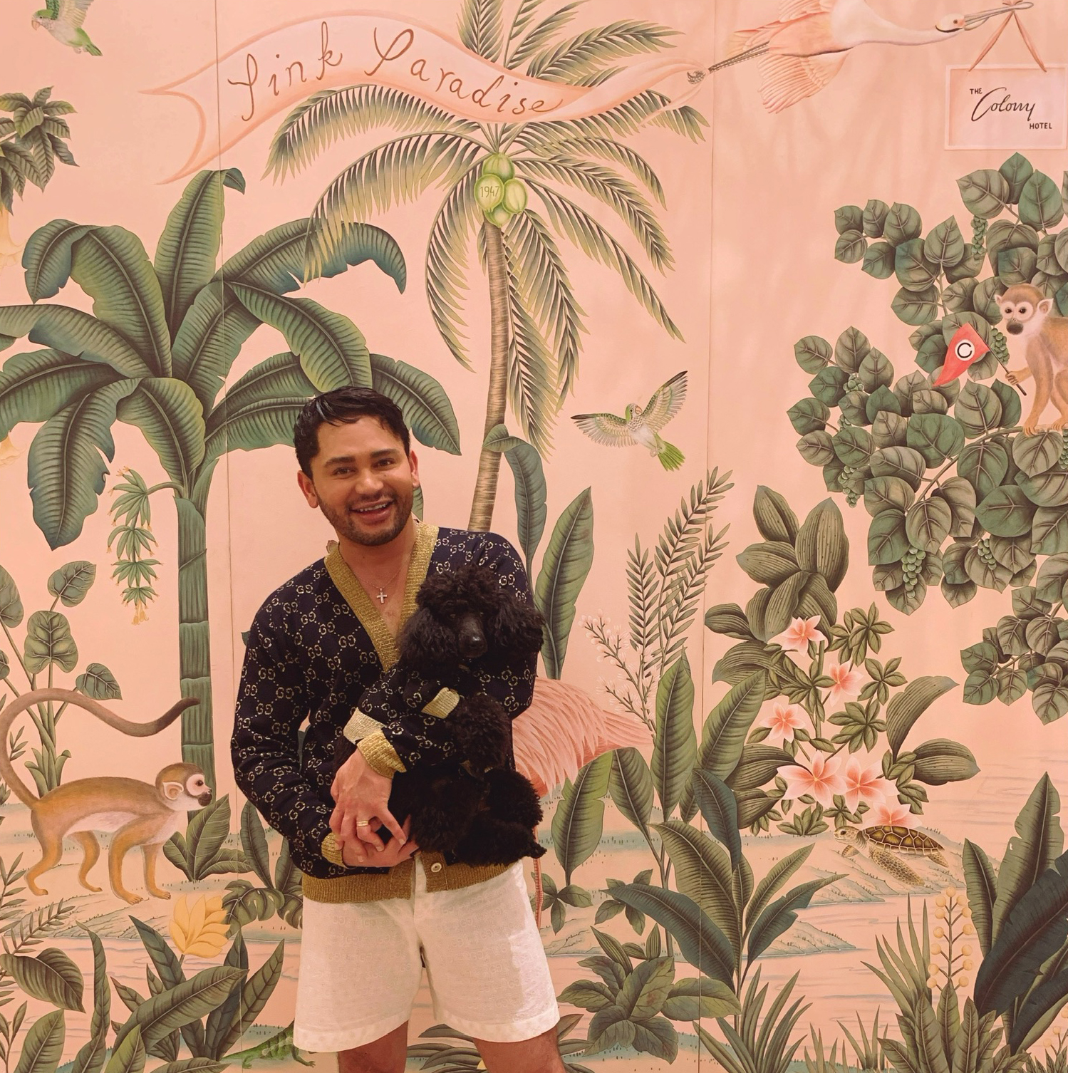 Isaac Boots in front of de Gournay wallpaper at The Colony Hotel