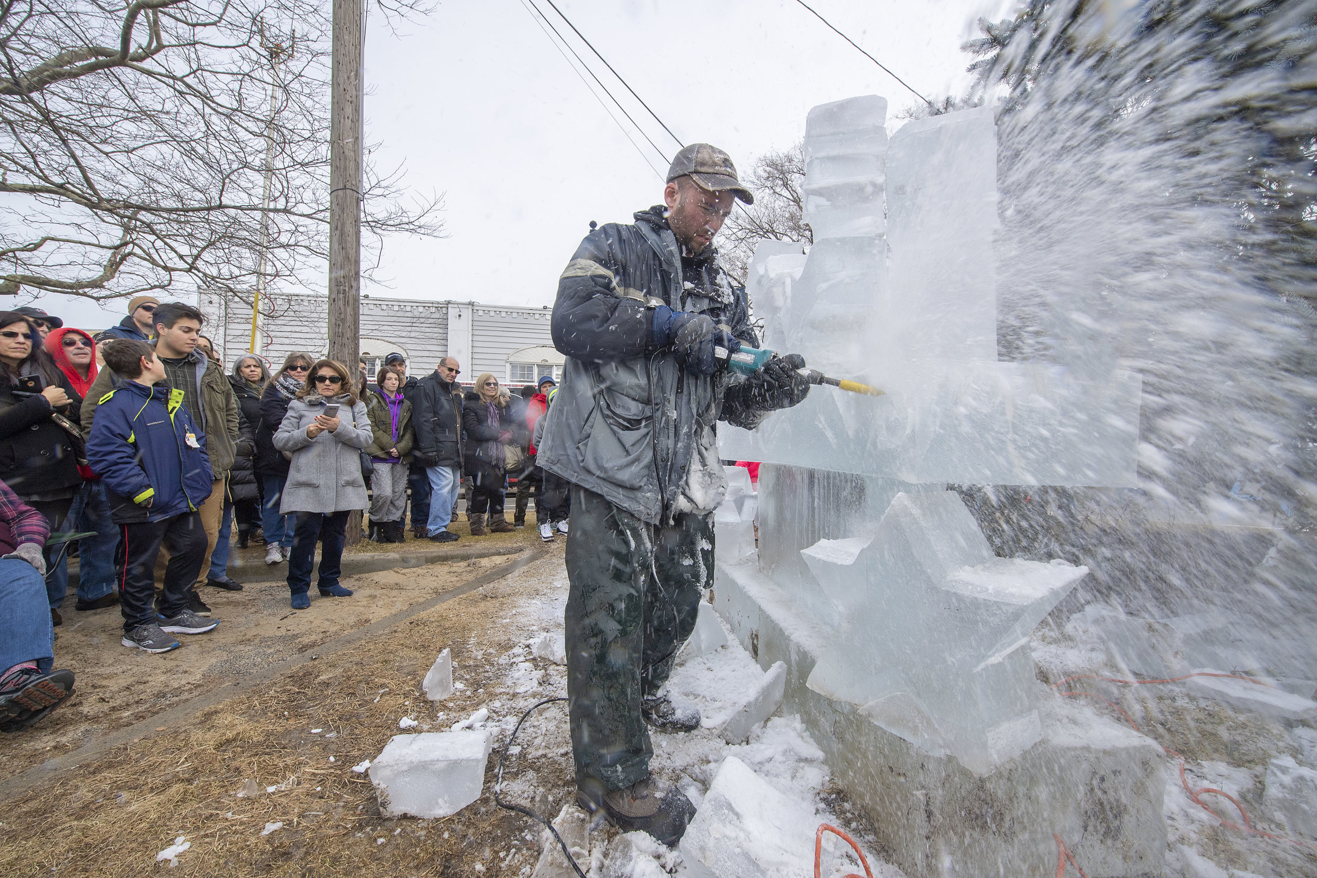 Rich Daly of Ice Melodies carving an ice sculpture on Long Wharf during HarborFrost 2019.