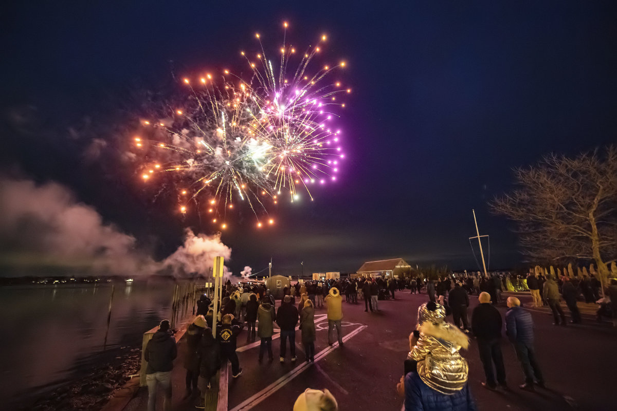 Fireworks from the world-famous Grucci family explode spectacularly over Long Wharf during HarborFrost