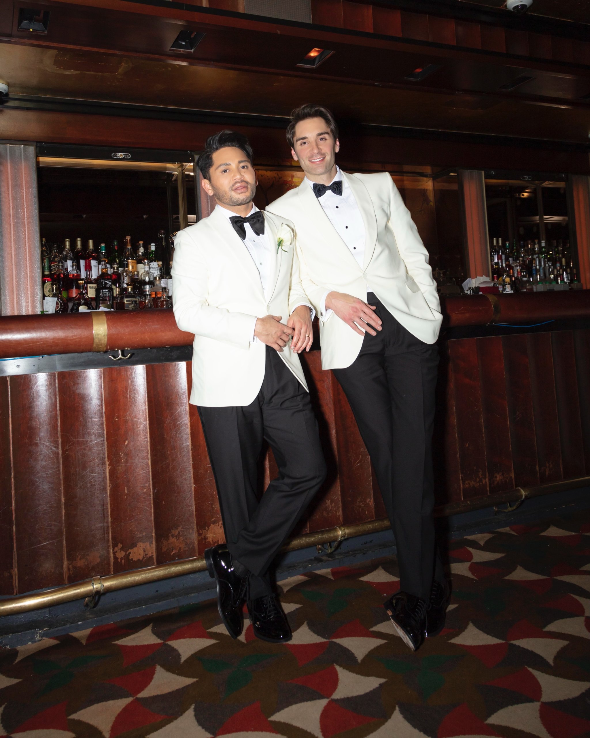 Isaac Boots and Jeffery O’Brecht wearing tuxedos at their wedding