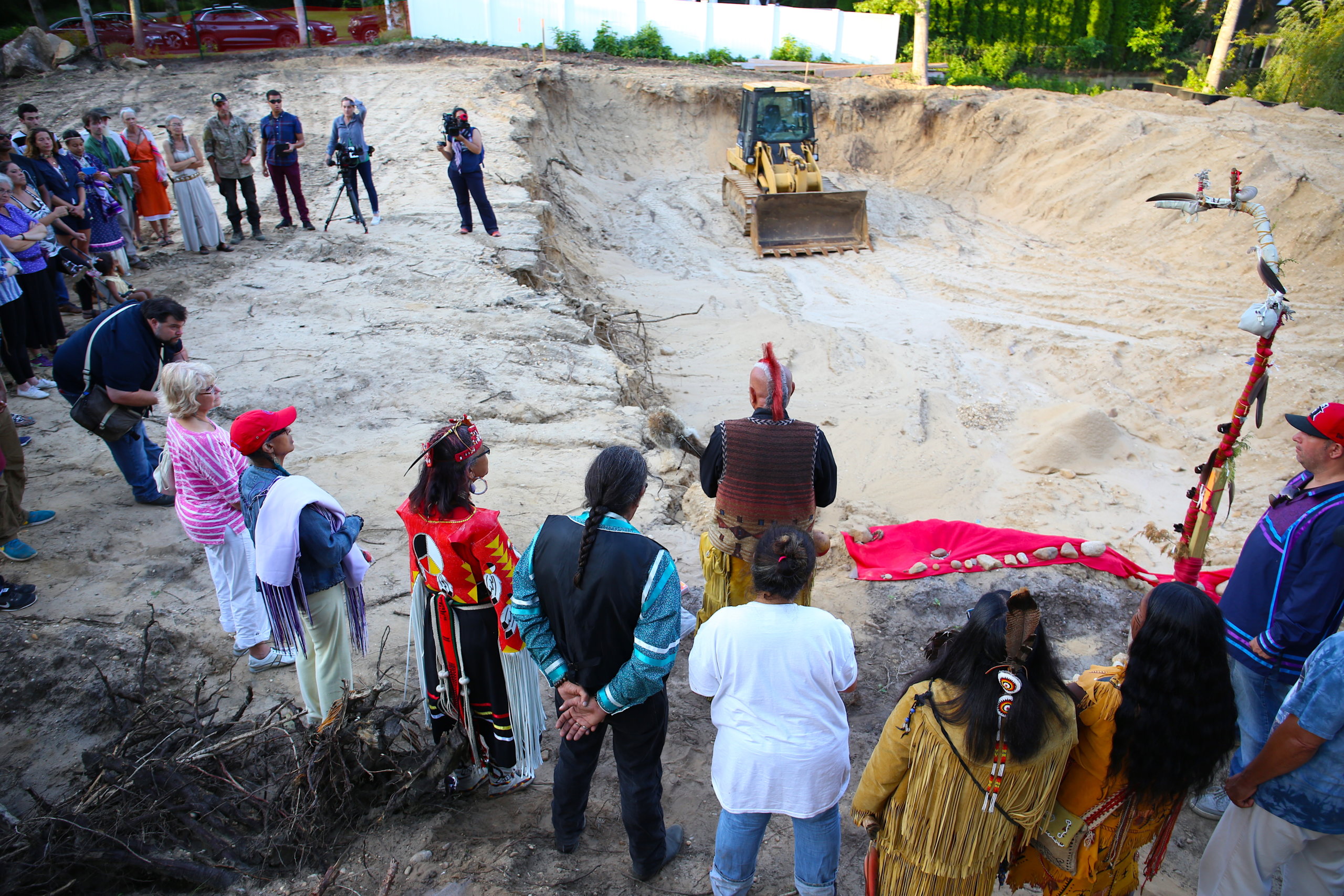 Shinnecock Nation members and friends gather to honor remains found at a development on the tribe's sacred Sugar Loaf Hill burial grounds