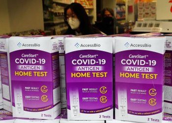 COVID-19 home test kits are pictured in a store window during the coronavirus disease (COVID-19) pandemic