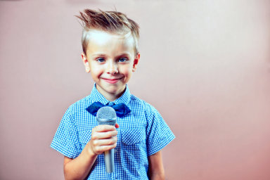A child with a microphone in his hand