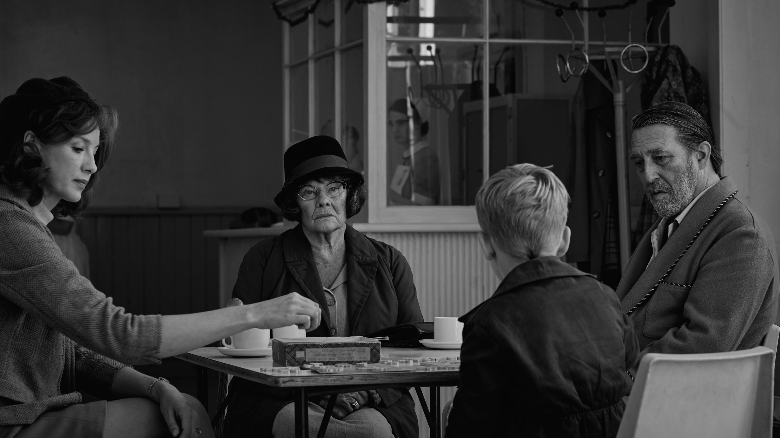 (L to R) Caitriona Balfe as "Ma", Judi Dench as "Granny", Jude Hill as "Buddy", and Ciarán Hinds as "Pop" in director Kenneth Branagh's "Belfast"