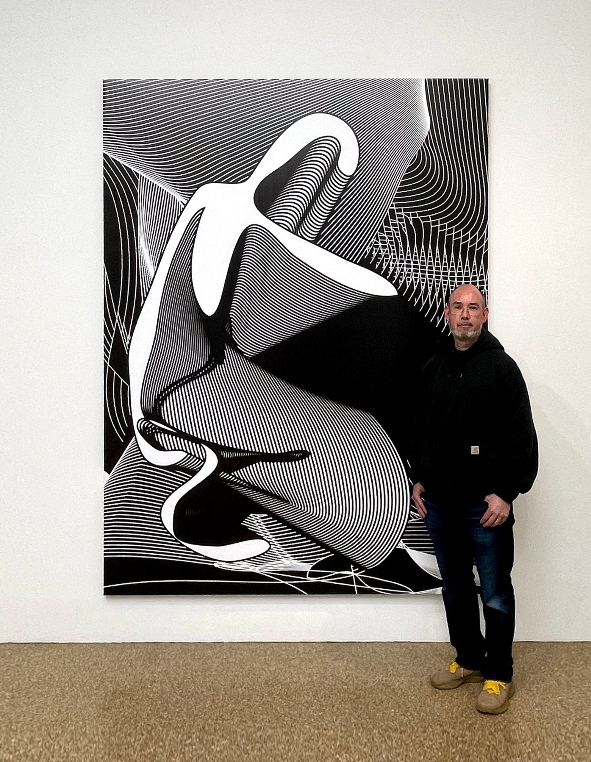 Colin Goldberg with his "Kneeling Icon" print at Techspressionism exhibition