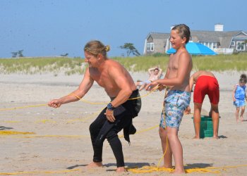 Brendan Regan and a student work the lines