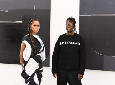 Racquel Chevremont and Mickalene Thomas, in front of work by Torkwase Dyson in "Set It Off" at the Parrish Art Museum