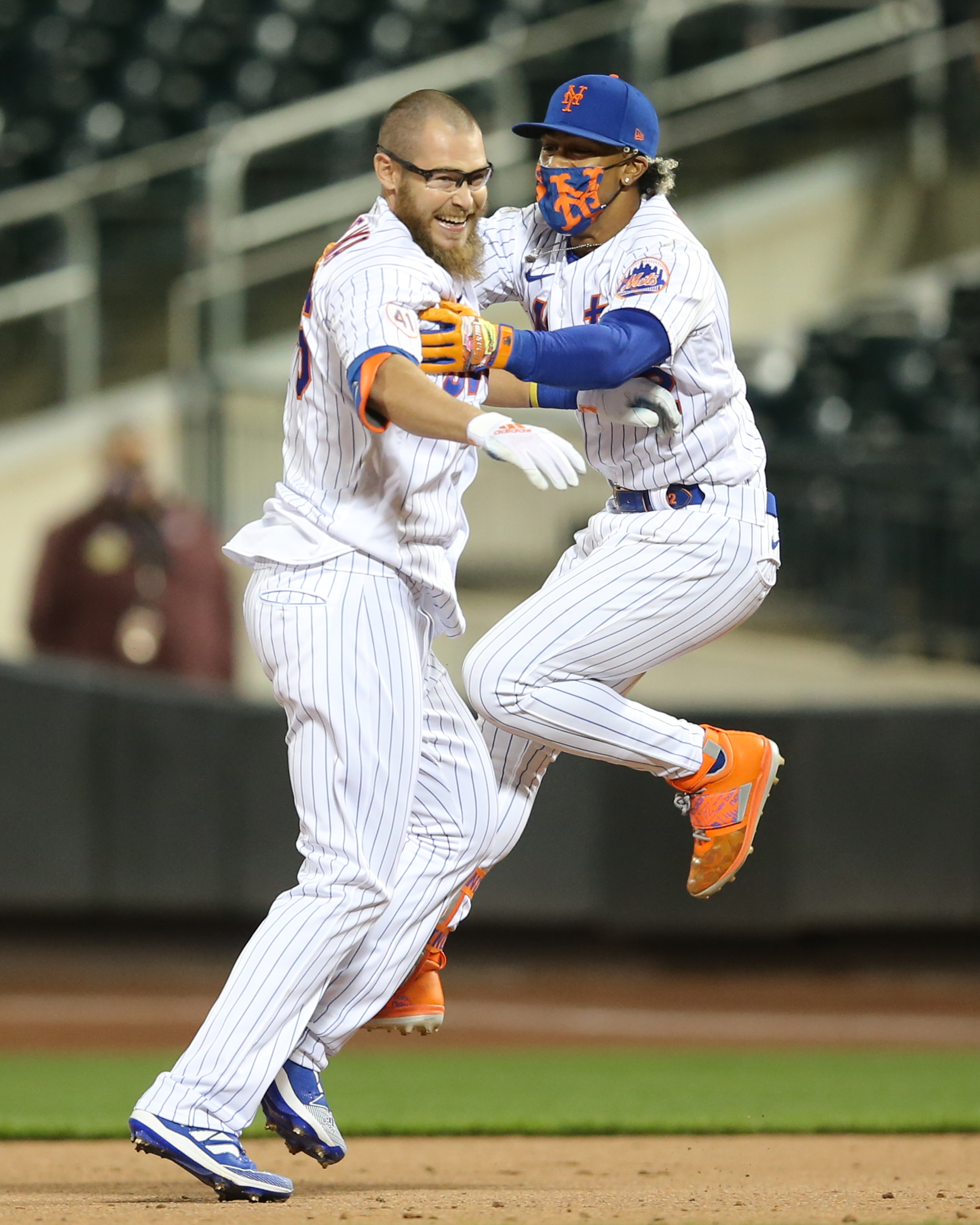 New York Mets pinch hitter Patrick Mazeika (76) celebrates with shortstop Francisco Lindor (12) after his game-winning RBI during the bottom of the ninth inning against the Baltimore Orioles at Citi Field.