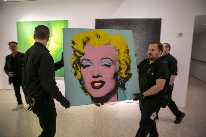 "Shot Sage Blue Marilyn" by Andy Warhol is carried in Christie's showroom