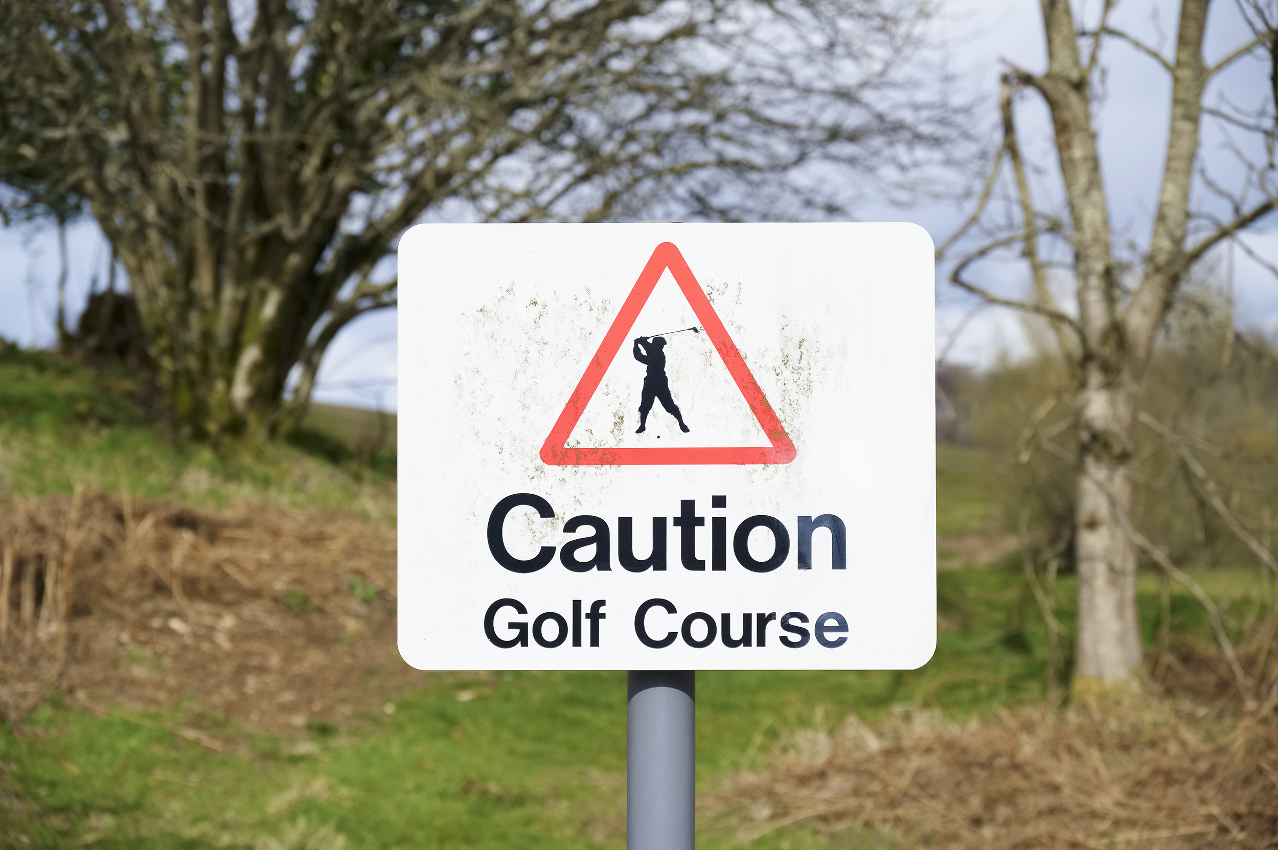 Beware of golf balls sign of the golf course near you