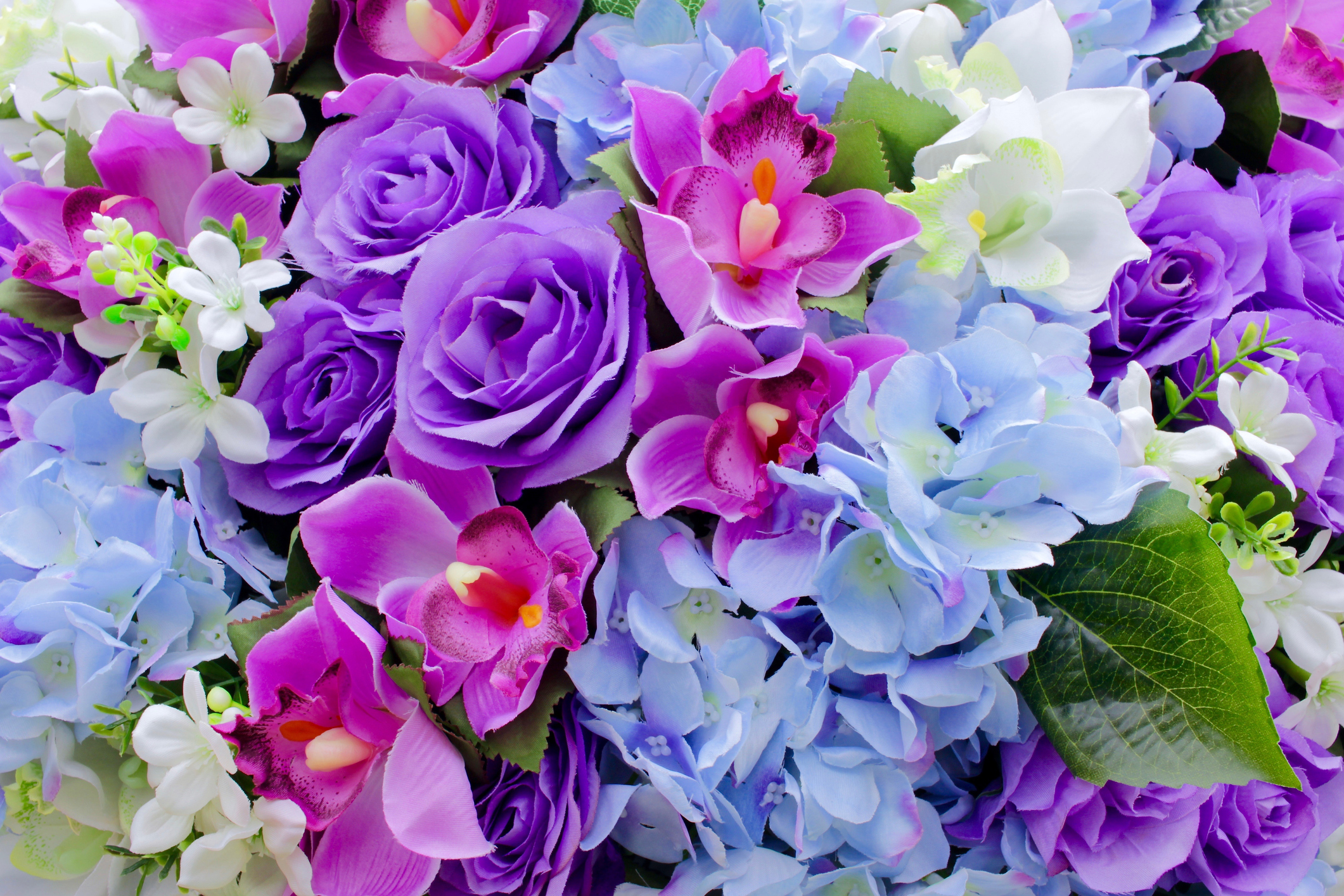 Colorful artificial flower background, purple, pink, white, blue, pink, orchid