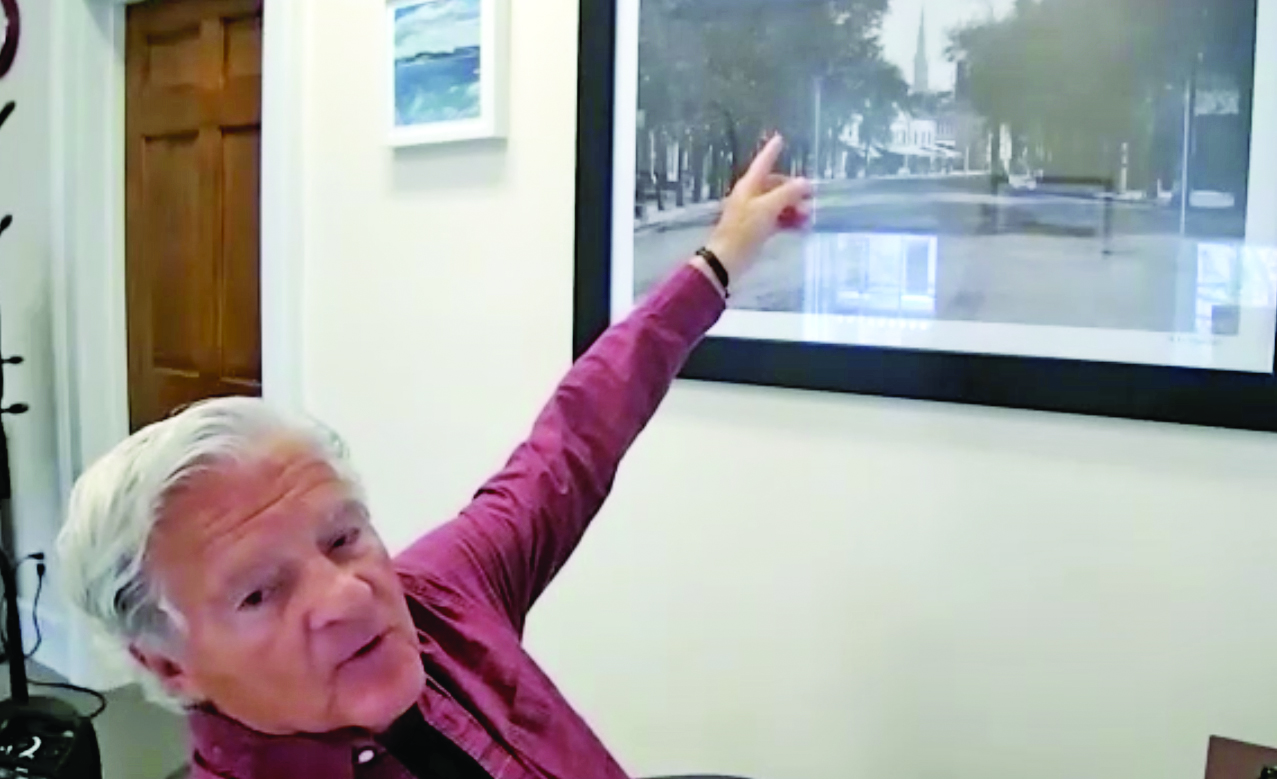 Mayor Larocca pointing to his Sag Harbor Main Street photo