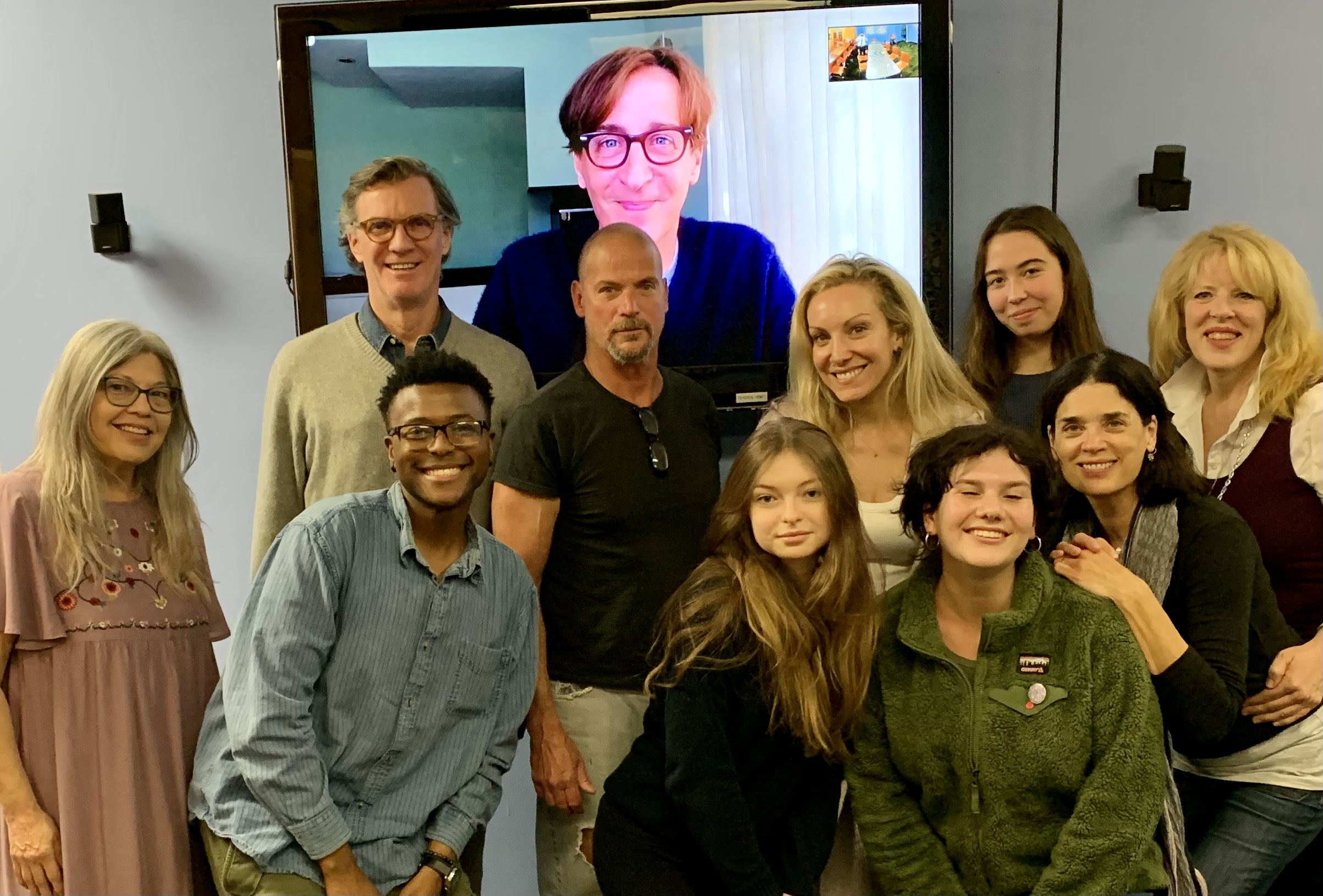 Stan Zimmerman (on screen) with (back row): Matthew Conlon, Joe Pallister, Rachel Feldman, Amala Astor, Valerie diLorenzo; (front row): Elena Sweeney, King Johnson, Nin Dobiszewska, Nicole Seltz, Susan Stout of "Right Before I Go," a play inspired by suicide notes