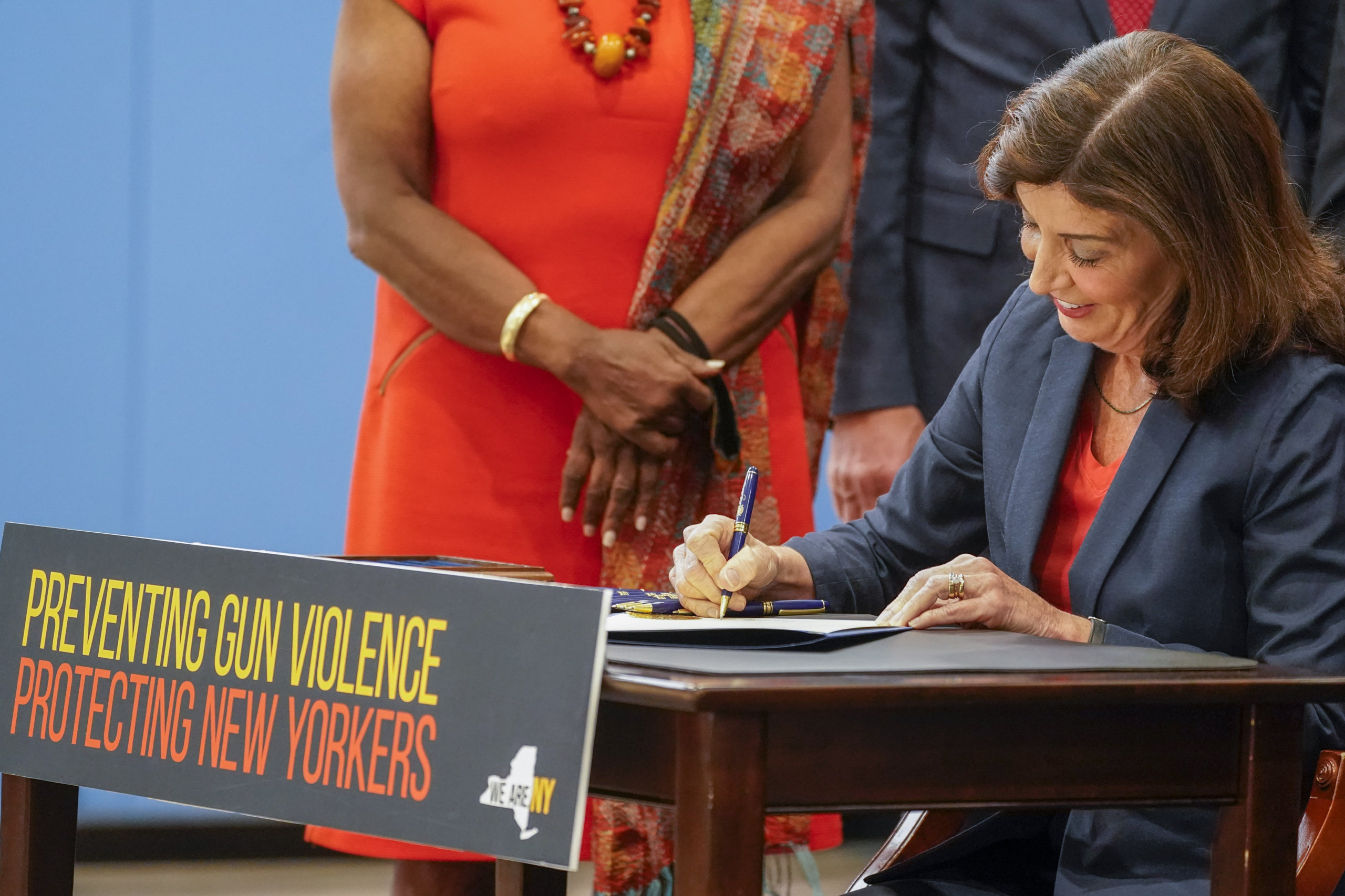 New York Gov. Kathy Hochul signs a package of bills to strengthen gun laws, Monday, June 6, 2022, in New York. New York has strengthened gun laws as part of a series of laws signed this week by Gov. Kathy Hochul with the hope to lessen gun violence and gun-related deaths. Hochul, a Democrat, signed 10 gun-related bills Monday.