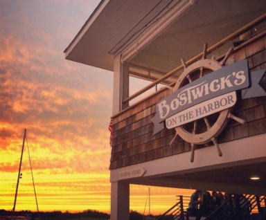 Sunset at Bostwick’s on the Harbor Hamptons waterfront restaurant