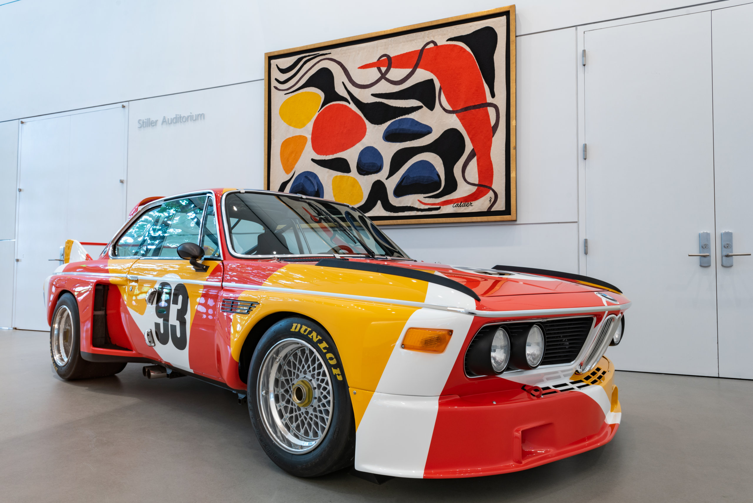 Calder Car: Installation of Special Guest: Calder BMW Art Car at the Norton Museum of Art (November 13, 2021 – April 24, 2022). Courtesy of Calder Foundation, New York. © 2021 Calder Foundation, New York / Artists Rights Society (ARS), New York. Photo: Ashley Kerr.