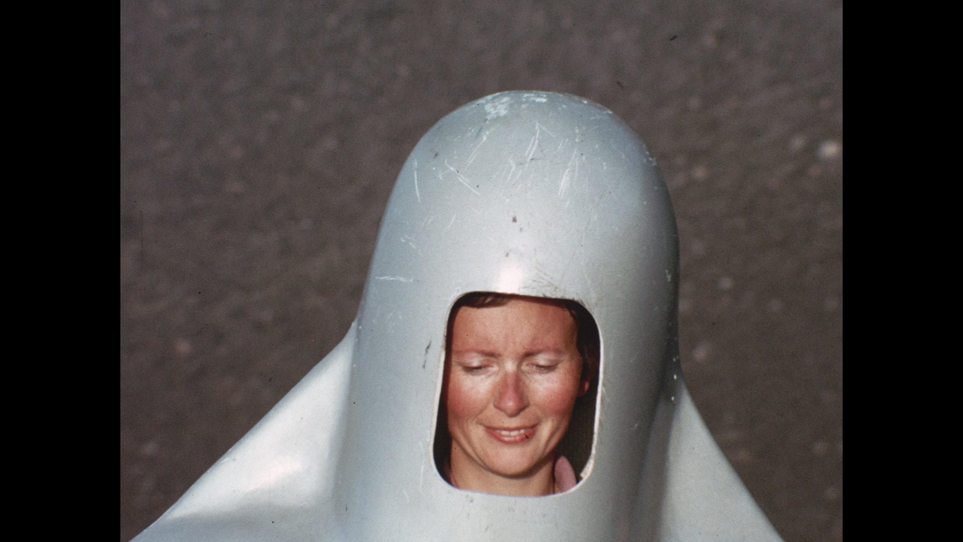 Katia Smiles in her giant metal helmet on Mt. Etna in 1972, from "Fire of Love," part of the HamptonsFilm 2022 Summer Docs Series