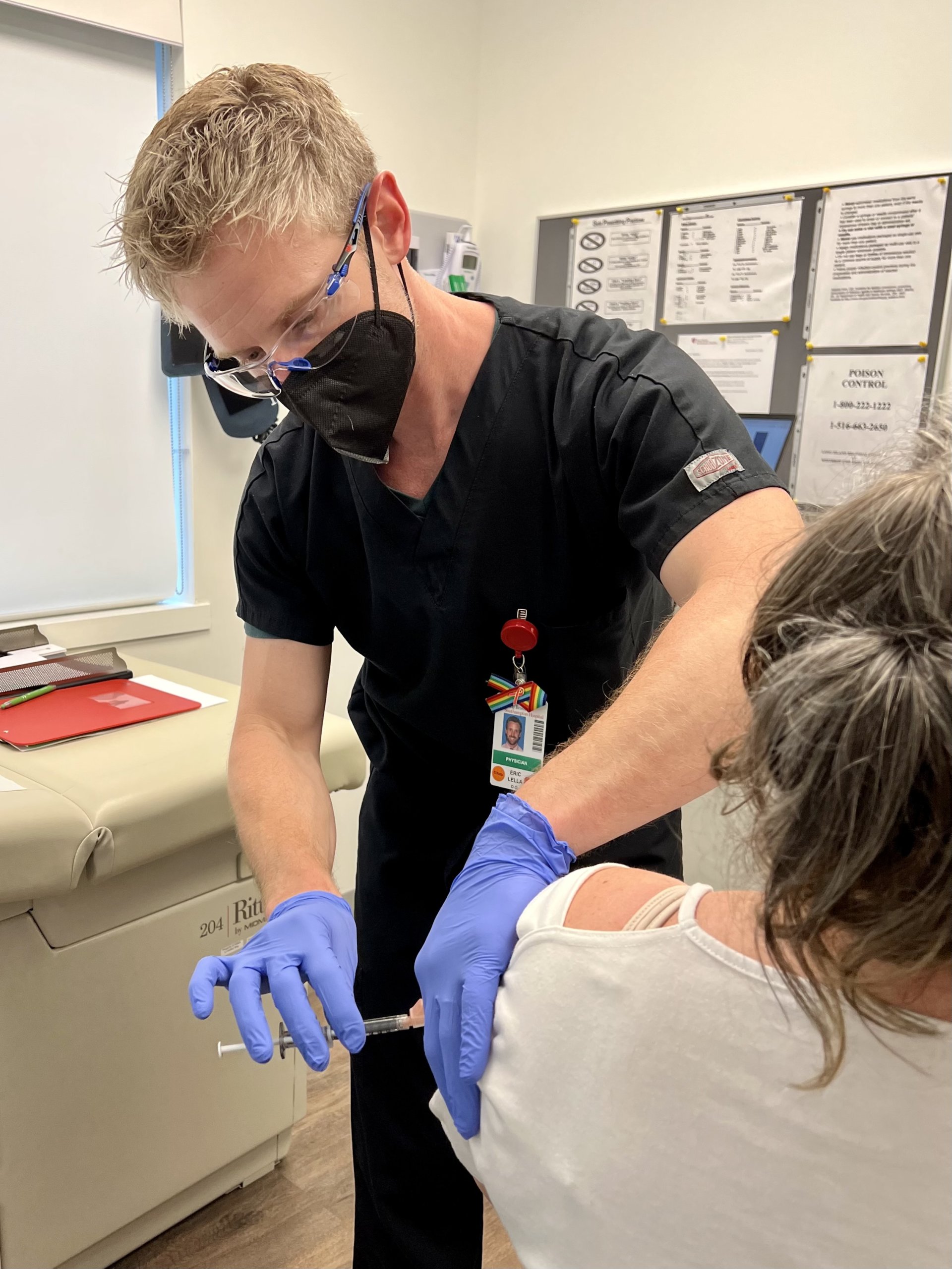 Dr. Eric Lella administering a vaccine - like he would for monkeypox