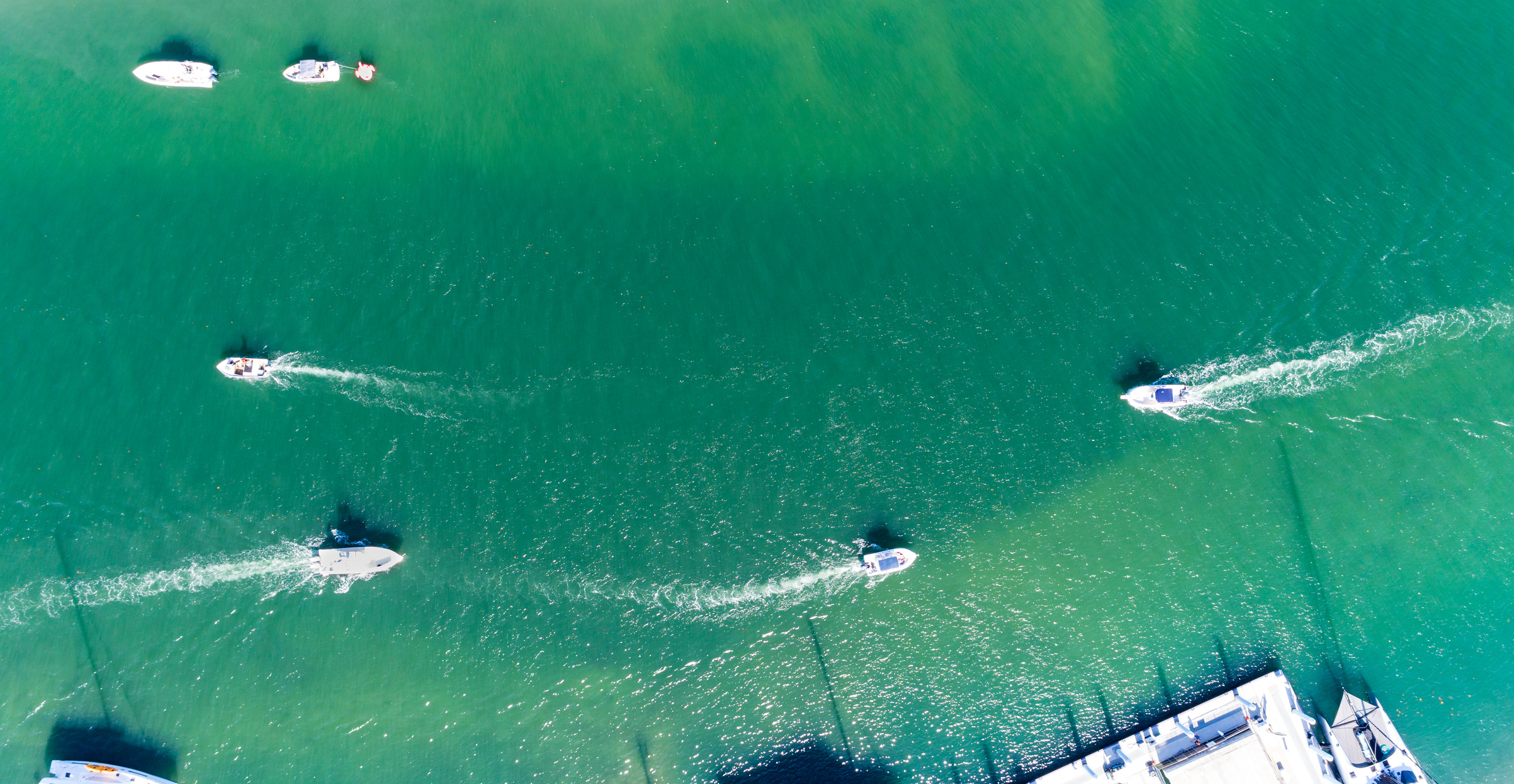 Aerial view of Peanut Island boating in Riviera Beach, Florida on memorial day weekend. Clear skies and blue water with plenty of boaters