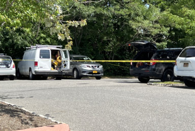 A man was found dead in this white van in Bridgehampton Commons on Thursday