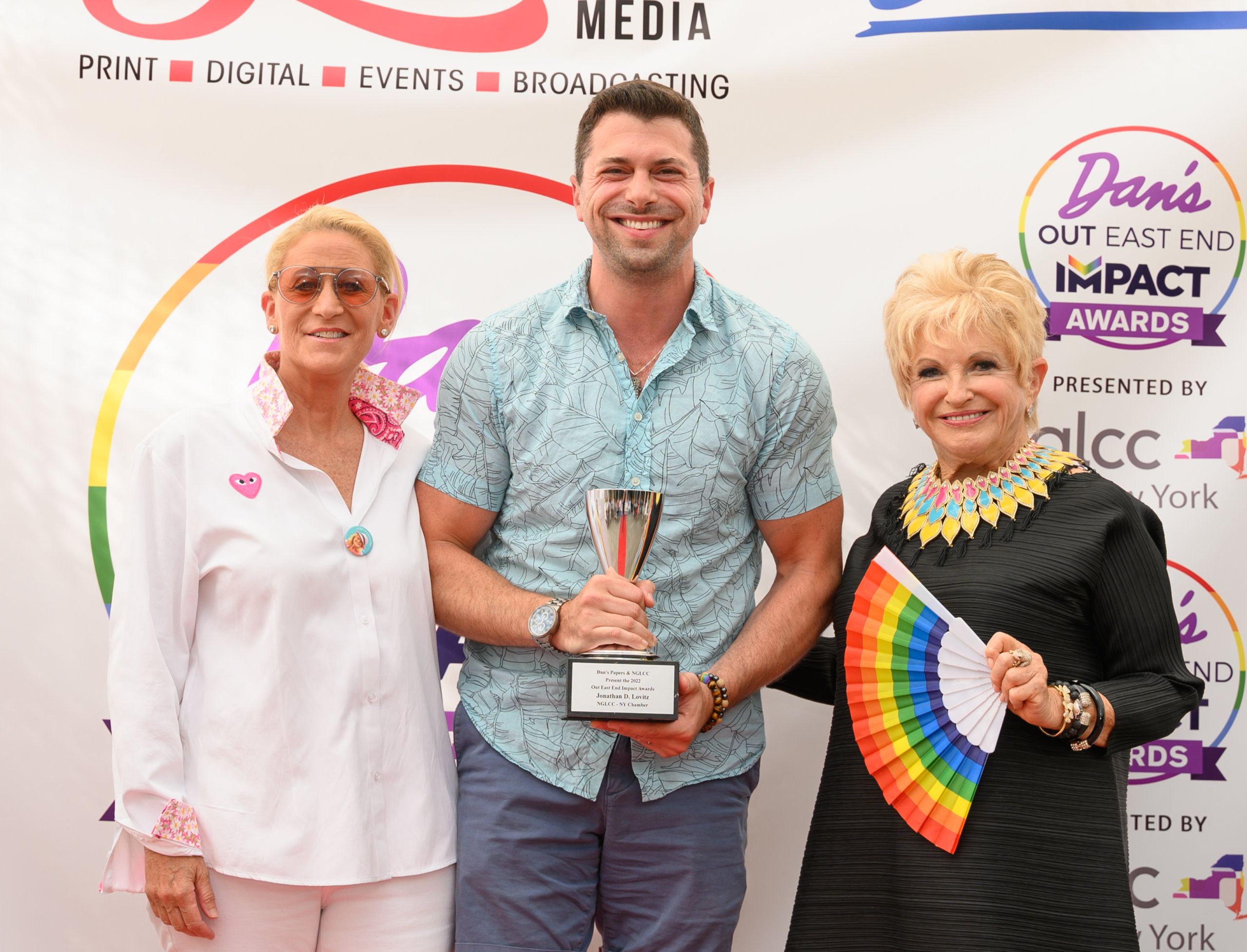 Out East End Impact Awards honoree Jonathan Lovitz with award presenter Judith Kasen-Windsor and Schneps Media president Victoria Schneps-Yunis