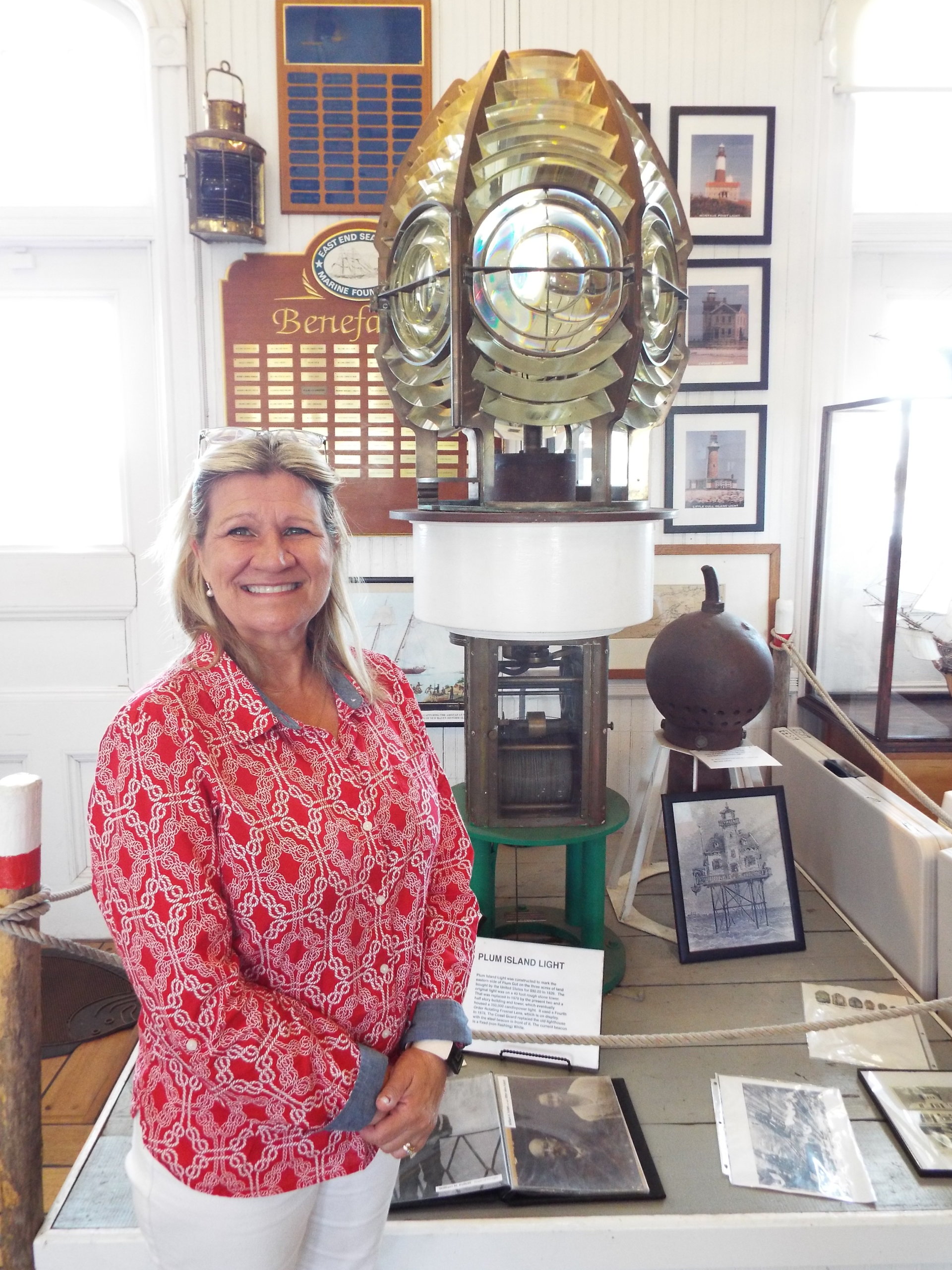 Tracey Orlando of East End Seaport Museum with their second order Fresnel lens 