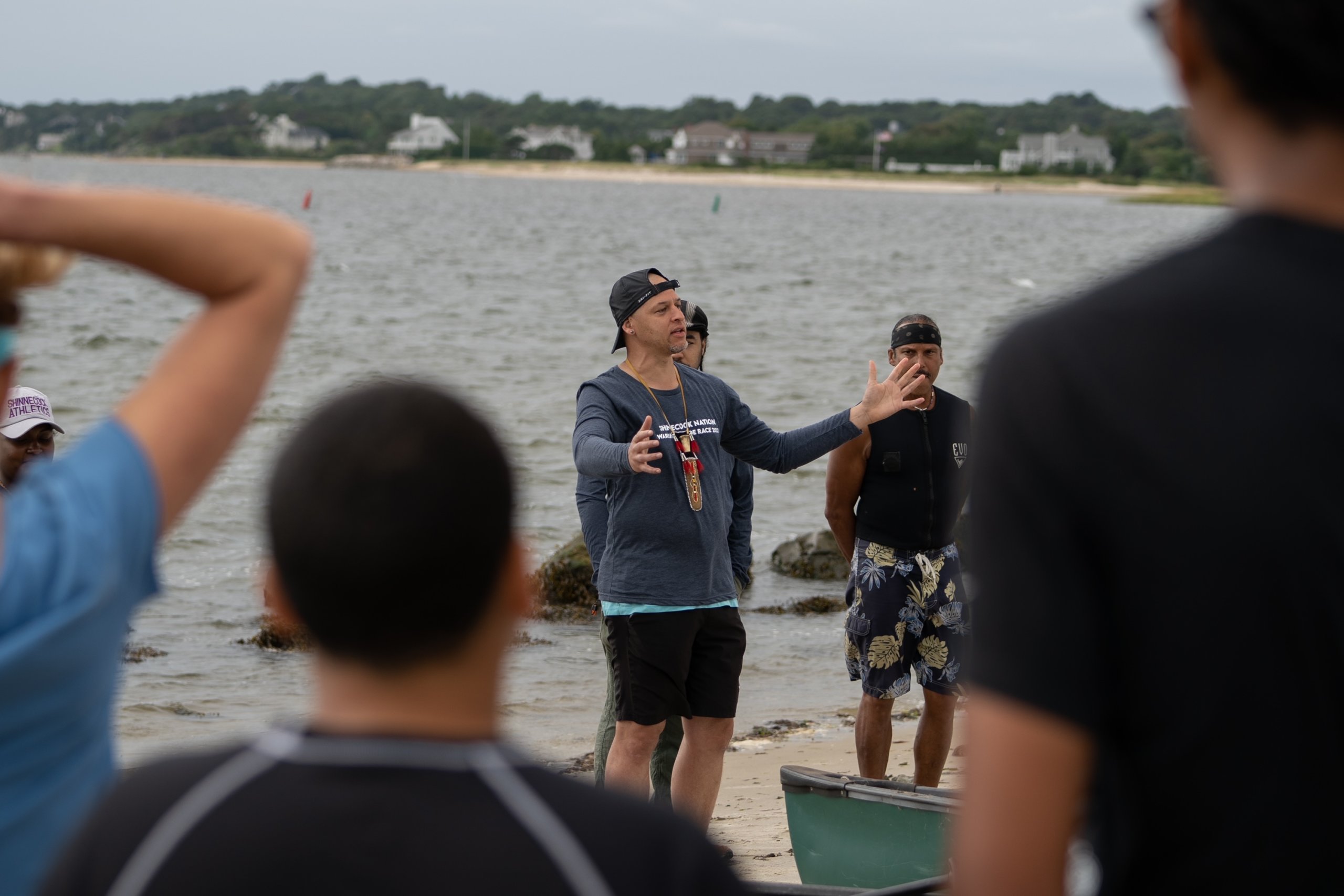 Annual Shinnecock Whalers Mishoon Race founder Christian Weaver addressing racers