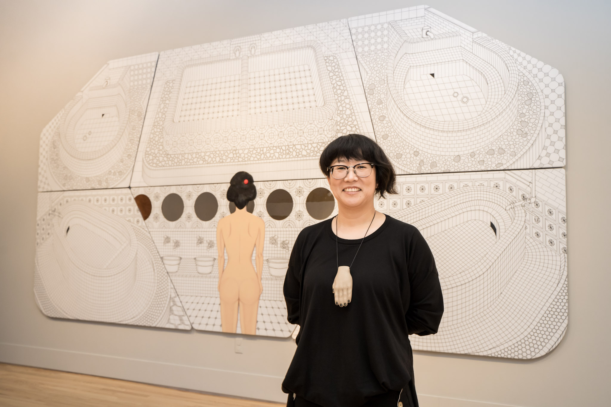 Hiromi Mizugai Moneyhun with her mural at Morikami Museum and Japanese Gardens