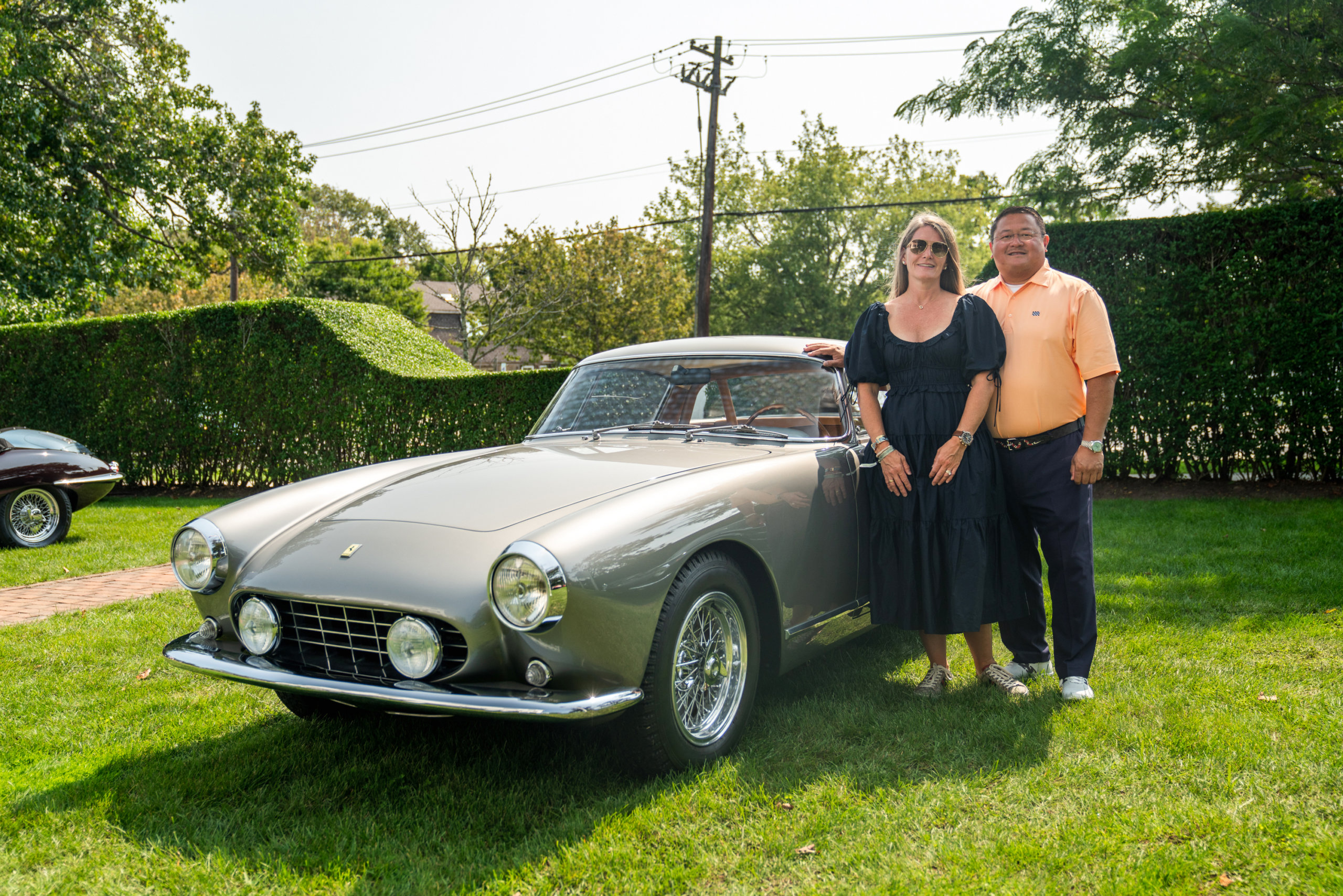 Richard and Kate Pineda with their vintage Ferrari 250 GT Coupe at Topping Rose House in Bridgehampton